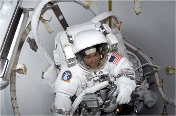 Astronaut Daniel Bursch suited up in the airlock onboard the International Space Station